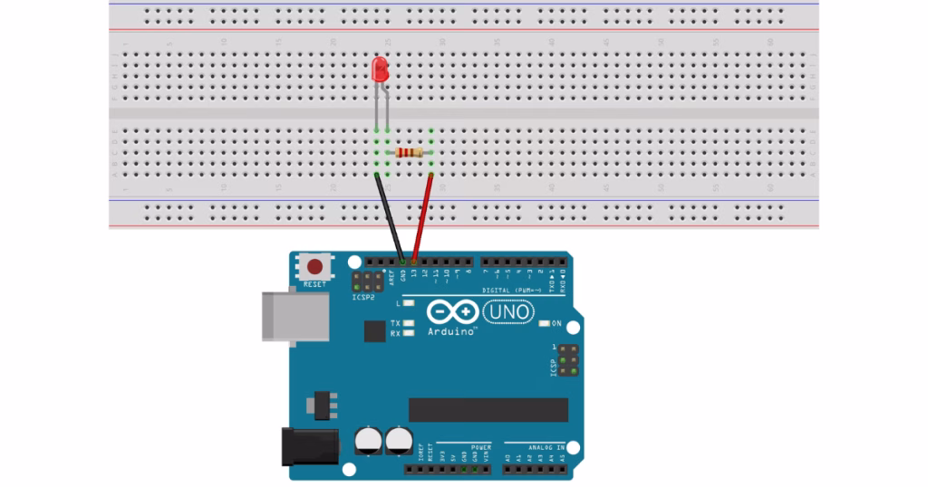 Arduino Uno connected to an LED on a breadboard with a resistor and jumper wires for a beginner project in Nigeria 1